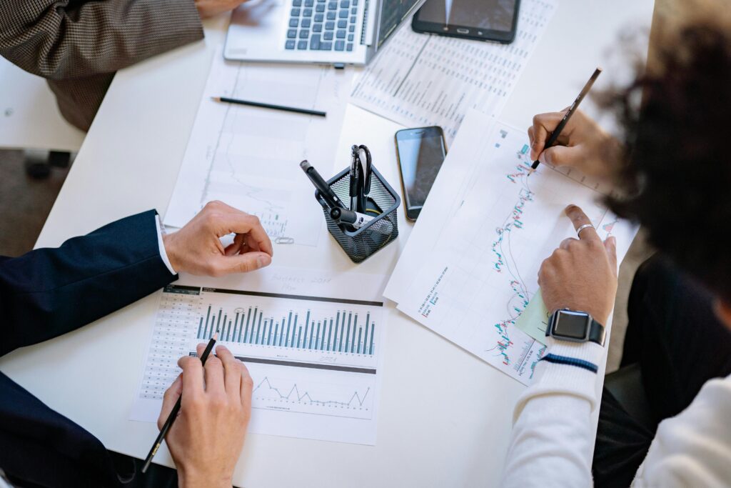 pexels photo 7698796 7698796 Business team analyzing financial charts and graphs during a collaborative meeting.